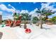 Fun splash pad with pirate ship, palm tree, and various water features for entertainment and summer enjoyment at 730 Longboat Dr, Davenport, FL 33896