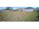 Expansive, fenced backyard offers lots of space for gardening, entertaining, or outdoor activities at 743 Belvoir Dr, Davenport, FL 33837