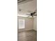 Bedroom includes wood-look floors, ceiling fan, window with blinds and neutral paint at 743 Belvoir Dr, Davenport, FL 33837