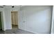 Bright bedroom with wood-look floors, closet space, and natural light from the windows at 743 Belvoir Dr, Davenport, FL 33837