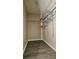Walk-in closet featuring vinyl floors and multiple wire racks at 743 Belvoir Dr, Davenport, FL 33837