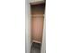A compact closet with a wire shelf provides tidy storage space at 743 Belvoir Dr, Davenport, FL 33837