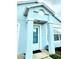 Close-up of the home's entrance featuring classic columns and a view of the interior at 743 Belvoir Dr, Davenport, FL 33837