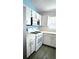 Well-appointed kitchen featuring white cabinets, ample countertop space, and contemporary appliances at 743 Belvoir Dr, Davenport, FL 33837