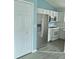 Updated kitchen featuring modern stainless steel appliances, white cabinetry, and a functional layout at 743 Belvoir Dr, Davenport, FL 33837