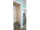 A well-organized pantry with wire shelving and a nearby refrigerator at 743 Belvoir Dr, Davenport, FL 33837