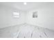 Well-lit bedroom featuring two windows, white molding, and updated marble floors at 758 Osceola Dr, Sanford, FL 32773