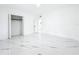 Bright, spacious bedroom with closet and ensuite bathroom entrances, and gorgeous marble floors at 758 Osceola Dr, Sanford, FL 32773