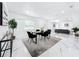 Bright dining room featuring a modern table set, stylish rug, and open-concept design leading to living area at 758 Osceola Dr, Sanford, FL 32773