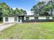 Inviting single-story home with manicured lawn, updated paint, and classic curb appeal at 758 Osceola Dr, Sanford, FL 32773