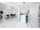 Open-concept living room and kitchen with marble floors, modern lighting, and stainless steel appliances at 758 Osceola Dr, Sanford, FL 32773