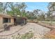 Backyard featuring a screened porch and mature landscaping at 811 Gatehouse Dr, Winter Springs, FL 32708