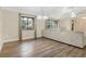 Bright living room with hardwood floors, comfortable sofa, and large windows at 811 Gatehouse Dr, Winter Springs, FL 32708