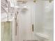 Modern glass shower with gold fixtures, a rainfall shower head, and a built-in bench at 811 Gatehouse Dr, Winter Springs, FL 32708