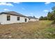 View of the backyard with multiple homes in a community, bright, open and move-in ready at 833 S Hancock Dr, Deltona, FL 32725