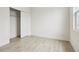 Bright bedroom features fresh paint, modern baseboards, and a spacious closet at 833 S Hancock Dr, Deltona, FL 32725