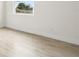 Bedroom featuring a view from a bright window and modern flooring at 833 S Hancock Dr, Deltona, FL 32725