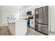 Modern kitchen with stainless steel appliances, quartz countertops, and sleek white cabinetry at 833 S Hancock Dr, Deltona, FL 32725