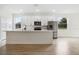 Modern kitchen with stainless steel appliances, a large island, and plenty of cabinet space at 833 S Hancock Dr, Deltona, FL 32725