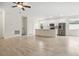 Spacious living room with a kitchen area that features modern stainless steel appliances at 833 S Hancock Dr, Deltona, FL 32725