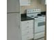 Close-up of white refrigerator and white range at 860 N Orange Ave # 444, Orlando, FL 32801