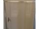 Simple bathroom shower featuring a glass door and chrome shower head at 860 N Orange Ave # 444, Orlando, FL 32801