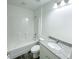 Bathroom with new single sink vanity, shower-tub combo and new fixtures and lighting at 1 Pine Radial Trl, Ocala, FL 34472