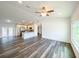 Open-concept living room features hardwood floors, recessed lighting, neutral walls and an eat-in kitchen and breakfast bar at 1 Pine Radial Trl, Ocala, FL 34472