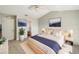 Neutral color, spacious bedroom features vaulted ceilings, modern furnishings, and plenty of natural light at 1004 Puget Ln, Kissimmee, FL 34759