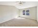 Cozy bedroom featuring plush carpeting and a bright window, offering a comfortable and relaxing retreat at 1004 Puget Ln, Kissimmee, FL 34759