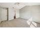 Calm bedroom with neutral walls, ceiling fan and soft carpet flooring at 1004 Puget Ln, Kissimmee, FL 34759