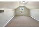 Versatile bonus room with carpet, perfect for a home office, playroom, or additional living space at 1004 Puget Ln, Kissimmee, FL 34759