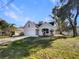 Charming home featuring a two-car garage, neat landscaping, and a welcoming front entrance at 1004 Puget Ln, Kissimmee, FL 34759
