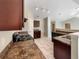 Functional kitchen featuring dark cabinetry, stone countertops, and modern appliances at 1004 Puget Ln, Kissimmee, FL 34759