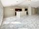 Spacious living room boasts stylish tile flooring, modern lighting, and an open concept layout, perfect for entertaining at 1004 Puget Ln, Kissimmee, FL 34759