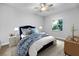 A nicely decorated bedroom features a comfortable bed, a window, and a view of the outside at 1024 Green Gate Blvd, Groveland, FL 34736