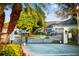 Secured entry gate to a private community, enhanced with decorative landscaping at 1024 Green Gate Blvd, Groveland, FL 34736