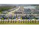 An aerial view of a new housing development with a pond at 11356 Sunsail Ave, Orlando, FL 32832