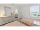 Bright bedroom featuring two twin beds, plush carpet and waterfront view at 11356 Sunsail Ave, Orlando, FL 32832
