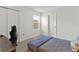 Cozy bedroom with plush carpet, a full bed, and natural light from the window at 11356 Sunsail Ave, Orlando, FL 32832