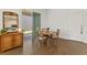 Charming dining area with wood table, sliding glass door, and decorative cabinet at 11356 Sunsail Ave, Orlando, FL 32832