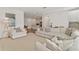 Spacious and bright living room, seamlessly connects to other living spaces in the home at 11356 Sunsail Ave, Orlando, FL 32832