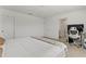 Bright main bedroom boasts an attached en-suite bathroom, a full bed, and modern lighting at 11356 Sunsail Ave, Orlando, FL 32832