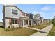 Street with houses with red shutters, landscaping, and a sidewalk create a welcoming neighborhood at 11356 Sunsail Ave, Orlando, FL 32832