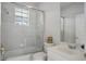 Bright bathroom featuring a glass door shower and modern sink with mirror at 11537 Claymont Cir, Windermere, FL 34786