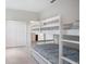 Bedroom featuring bunk beds and closet at 11537 Claymont Cir, Windermere, FL 34786