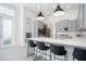 Modern kitchen with quartz counters, stainless steel appliances, and a breakfast bar with seating at 11537 Claymont Cir, Windermere, FL 34786