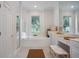 Bright main bathroom with double vanity, soaking tub, and separate glass-enclosed shower at 11537 Claymont Cir, Windermere, FL 34786