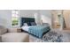 Comfortable main bedroom suite featuring a seating area and access to a luxurious ensuite bathroom at 11537 Claymont Cir, Windermere, FL 34786