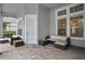 Covered patio featuring stylish wicker furniture, creating a relaxing outdoor living space at 11537 Claymont Cir, Windermere, FL 34786